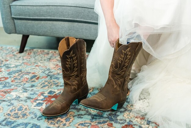 Closeup shot Bride wearing boots