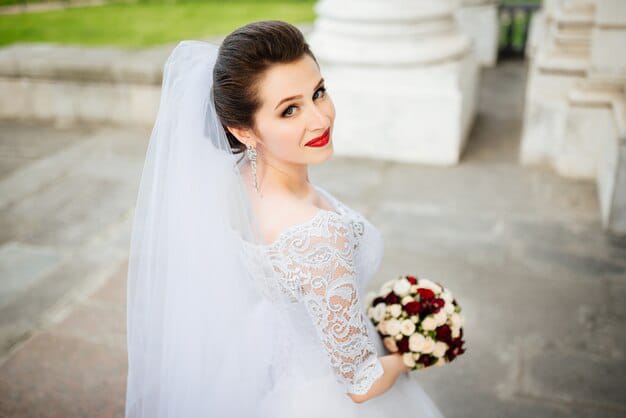 beautiful smiling bride with flowers