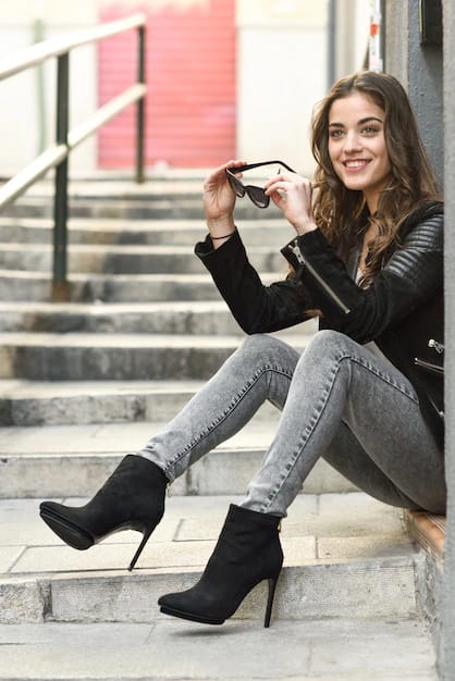 happy teenager in black boots