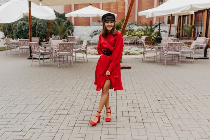 beautiful girl in red dress with red boots