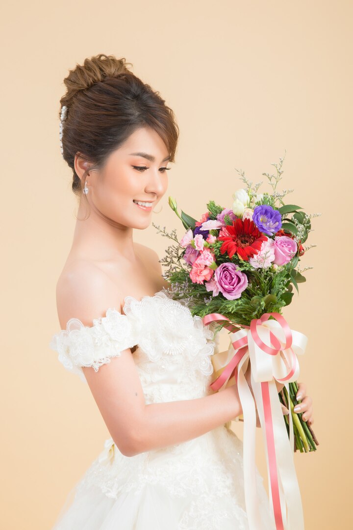 bride posing holding bouquets