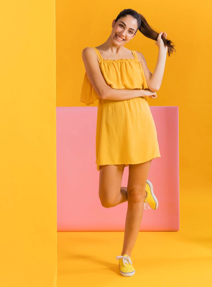 Simple pretty woman in yellow mini dress