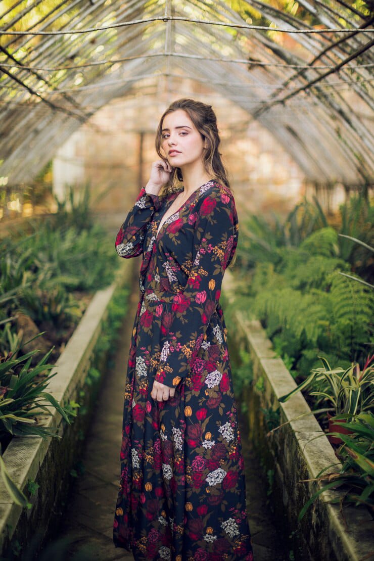 sideways posing woman floral dress