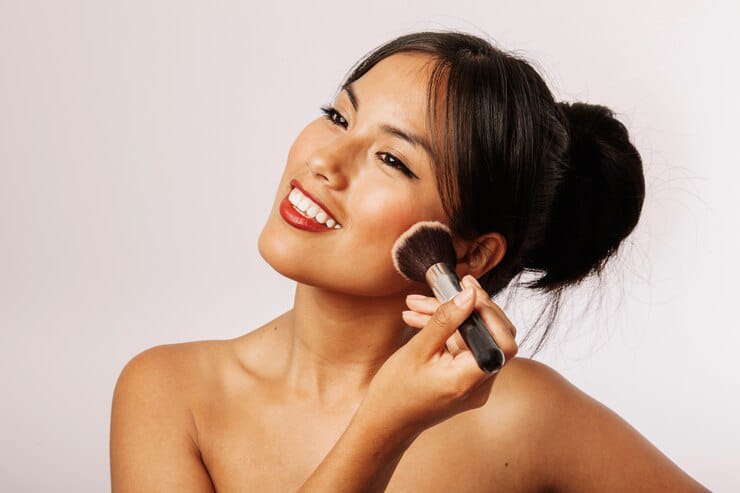 happy woman bronzer makeup