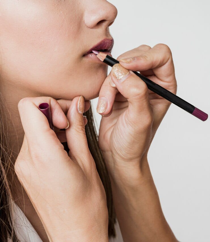 woman applying brown lip liner model