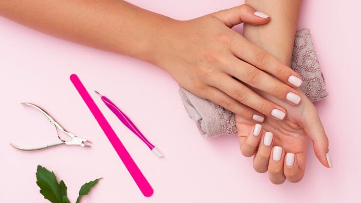 showing white nail polish with nail care products