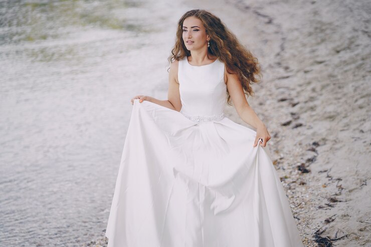 girl posing in white dress