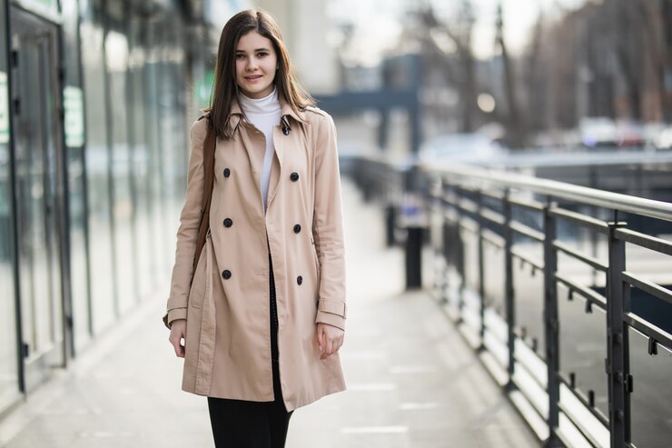 woman posing in long jacket