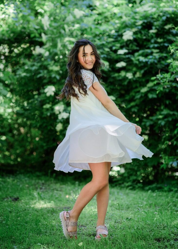 smiling woman white dress posing image