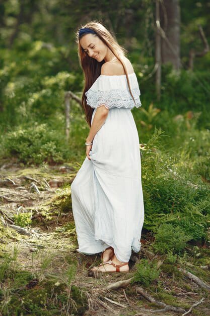 woman with long hair wearing comfortable off-shoulder dress