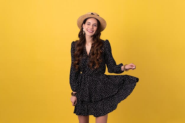 happy woman in white polka dot black dress