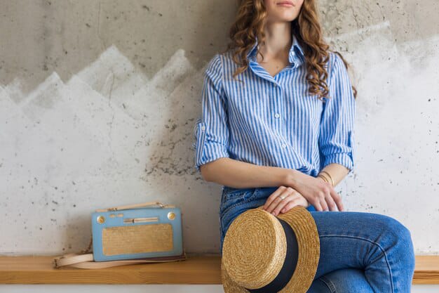 sitting on table women striped shirt look