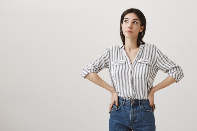 young women striped shirt look with jeans