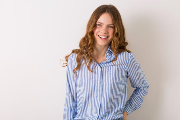 young smiling woman striped shirt portrait image